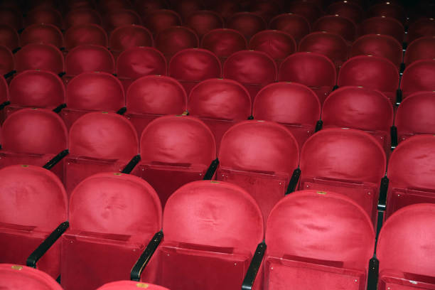 istock Classic rows of empty reddish seats in theatre 1211950930