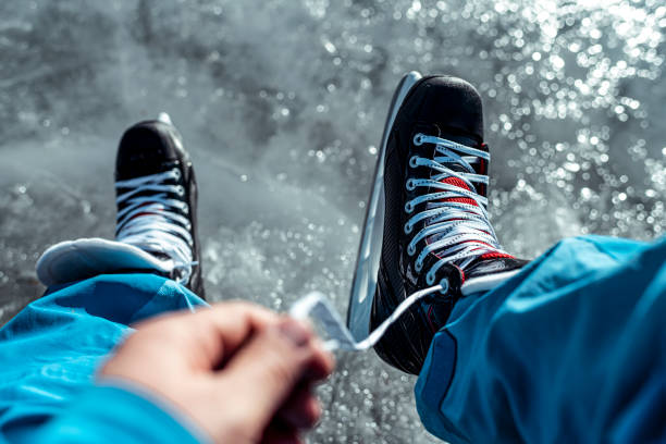 istock A subjective view of lacing up the ice skates while on ice 1211950965