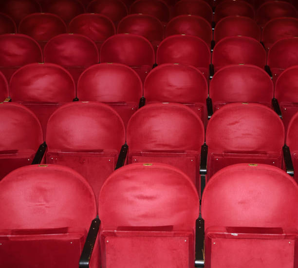 istock Classic rows of empty reddish seats in theatre 1211951124