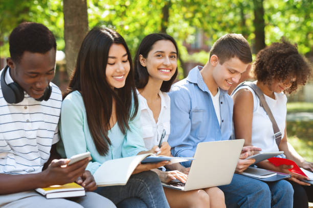 istock International students preparing for classes together in university courtyard 1211951173