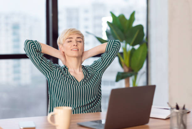istock Businesswoman Sitting Relaxing Having Break At Work In Modern Office 1211951366