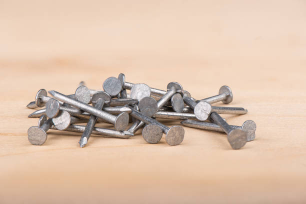 istock Metal nails on a wooden background. Copy space. 1211952597
