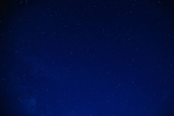 istock Milky way stars on a dark night sky. 1211953165