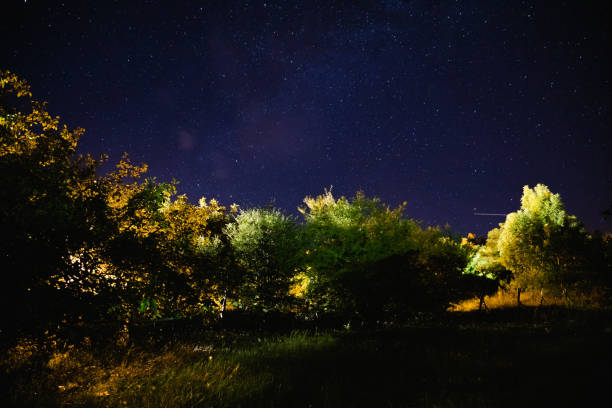 istock Milky way stars on a dark night sky. 1211953244