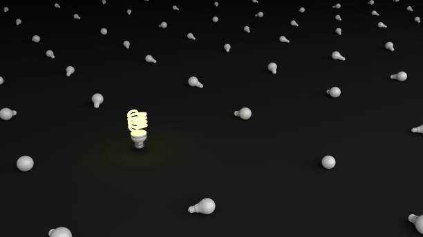 istock The Glowing white LED light bulb is surrounded by many white light bulb. Striking white LED light bulb. Glowing white LED light bulb Isolated on Simple black background,Minimalist Black, 3D rendering. 1211954442