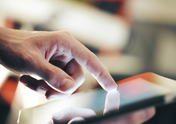 istock Businessman hand touching digital touch pad 1211955815