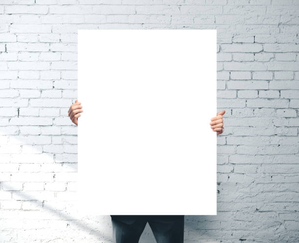 istock Businessman holding blank banner 1211956018