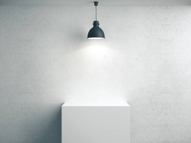 istock Blank concrete wall, podium and lamp. 1211956740