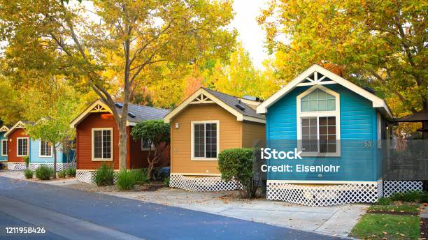 Countryside View Of Colored Wooden Buildings Stock Photo - Download Image Now - House, Log Cabin, Small