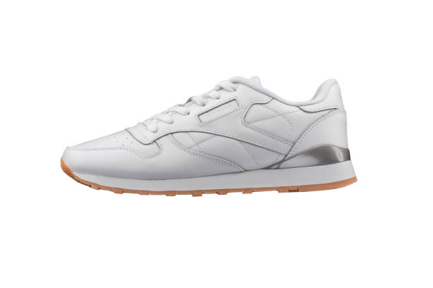 istock Sport shoes. White sneaker on a white background. 1211961077