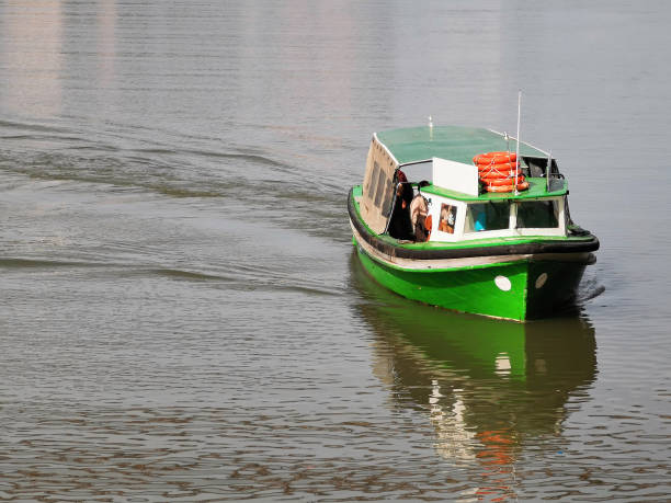 small ferry in Nervion River transporting people
