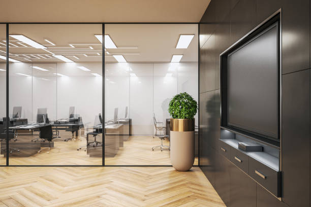 istock Modern conference interior room with blank tv screen 1211963189
