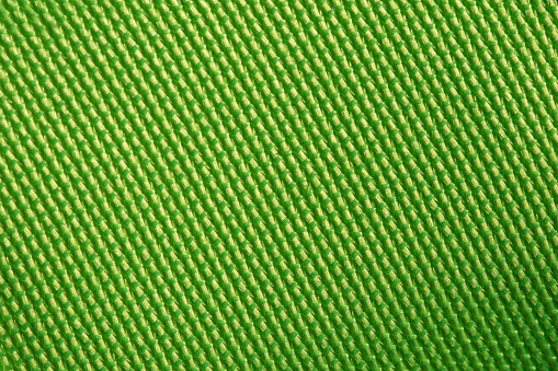 Texture of green cloth sports shoes.