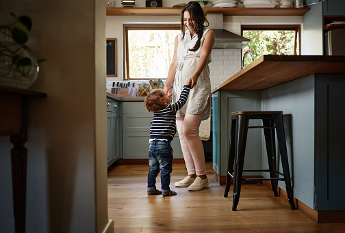 Shot of a young woman spending quality time with her adorable child at home