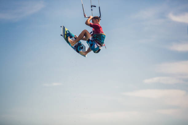 istock Professional kiter makes the difficult trick on a beautiful background. 1211964817
