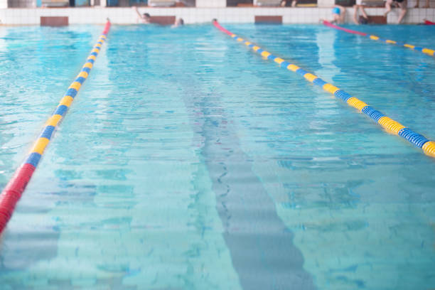 istock Lanes of a competition swimming pool 1211965780