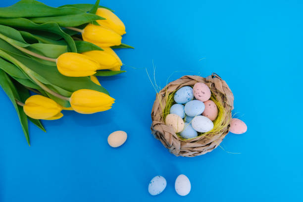 istock Happy Easter. Easter holiday decorations on trendy colored classic blue background. 1211967835