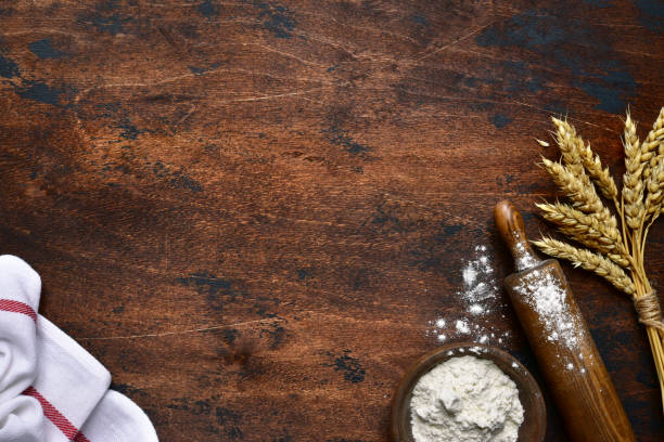 istock Baking background with flour, wheat ears and rolling pin 1211968104