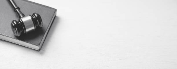 istock Judge gavel and book on the white desk. Space for your text. Law concept 1211968356