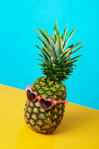 istock pineapple wearing heart-shaped sunglasses 1211969614