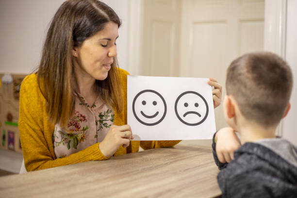 istock Emotion emoticons used by a psychologist during a therapy session 1211970178