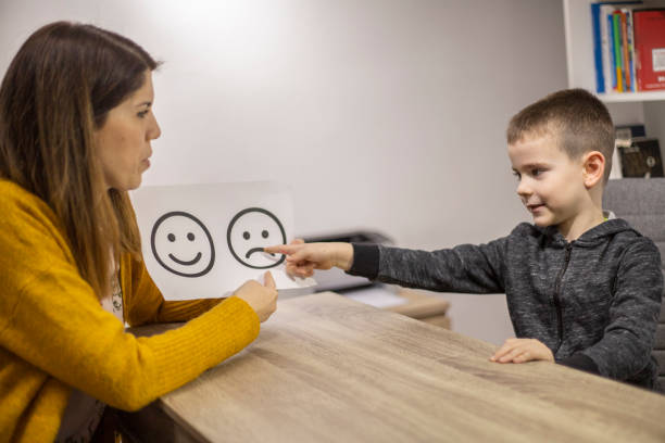 istock Emotion emoticons used by a psychologist during a therapy session 1211970189