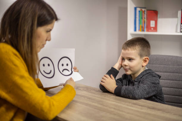 istock Emotion emoticons used by a psychologist during a therapy session 1211970199