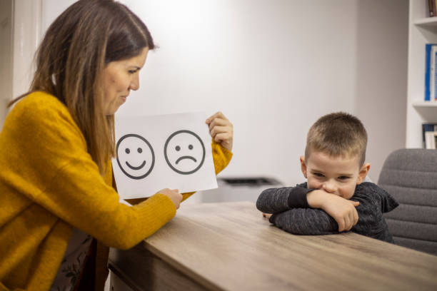 istock Emotion emoticons used by a psychologist during a therapy session 1211970205