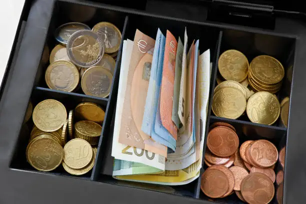 View into a well-filled cash box.