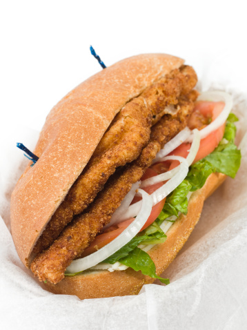 Veal or Chicken Milanese Sandwich on white background (this picture has been shot with a High Definition Hasselblad H3D II 31 megapixels camera and 120 mm f4H Hasselblad macro lens)