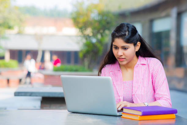 istock Student Sitting On Campus stock photo 1211974739