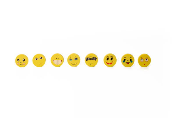 istock A few yellow round discs with funny faces 1211975740