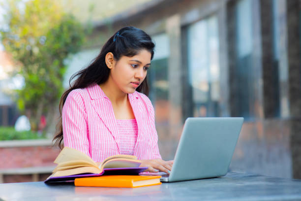 istock Student Sitting On Campus stock photo 1211975974