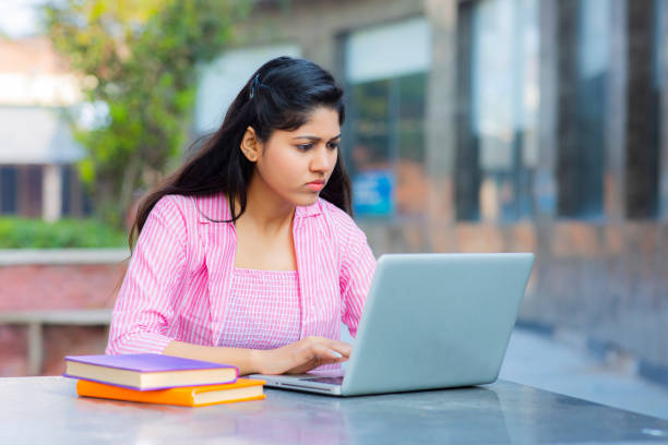 istock Student Sitting On Campus stock photo 1211976139
