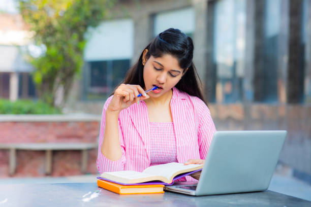 istock Student Sitting On Campus stock photo 1211976301