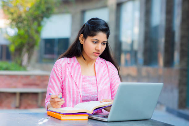 istock Student Sitting On Campus stock photo 1211976381
