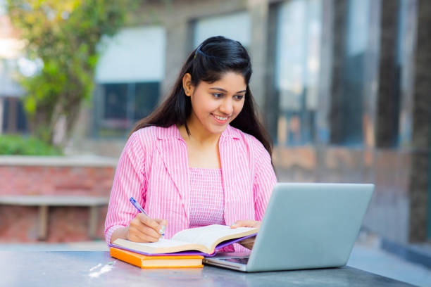 istock Student Sitting On Campus stock photo 1211976415