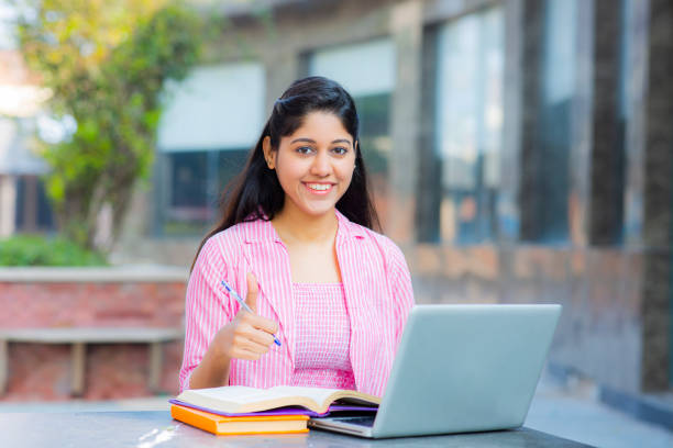 Student Sitting On Campus stock photo