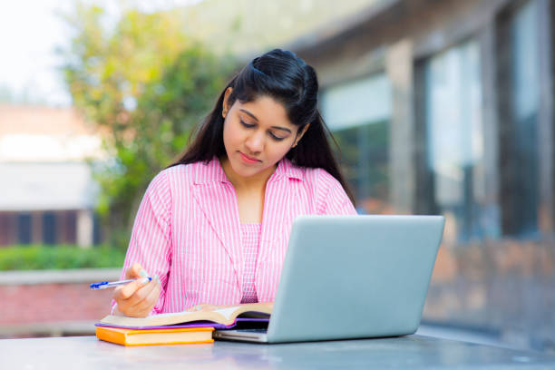 Student Sitting On Campus stock photo