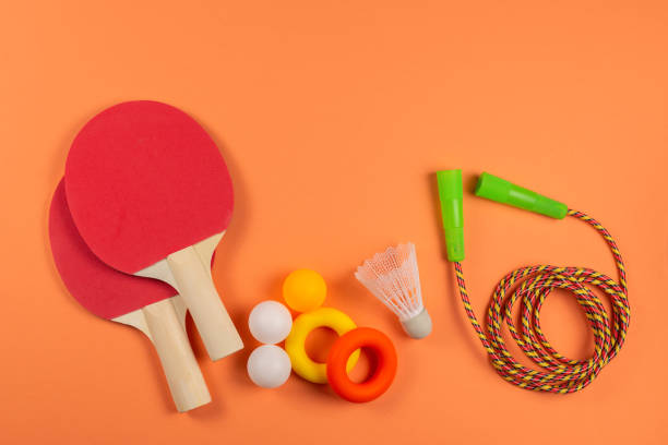 istock Sport equipment on orange background. 1211977958