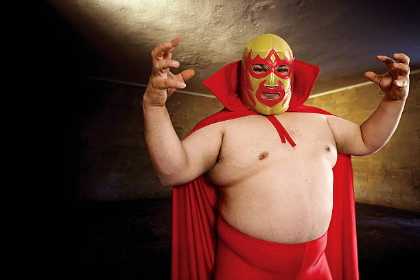 Luchador posing Photograph of a Mexican wrestler or Luchador posing. fat mexican man pictures stock pictures, royalty-free photos & images