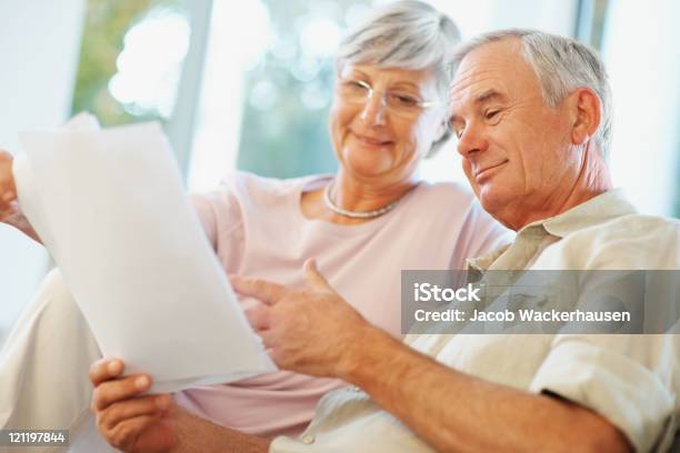Happy Senior Couple Planning For Retirement Stock Photo - Download Image Now - 60-64 Years, Active Seniors, Adult
