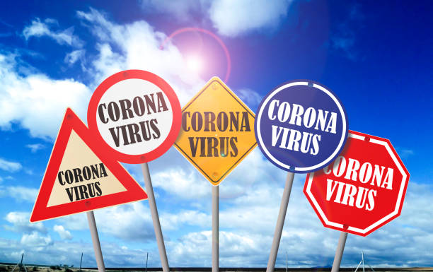 istock Road signs indicating coronavirus 1211980166