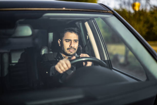 istock Middle Eastern Businessman Driving A Car. 1211980182