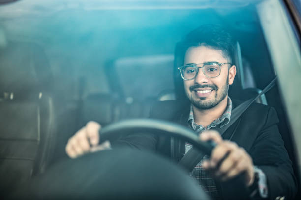 Middle Eastern Businessman Driving A Car.