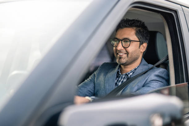 istock Middle Eastern Businessman Driving A Car. 1211981074