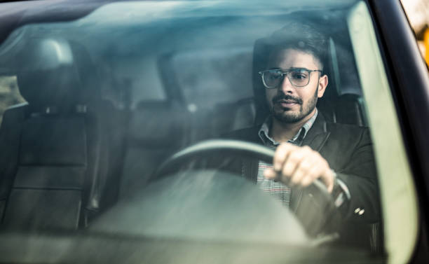 istock Middle Eastern Businessman Driving A Car. 1211981128
