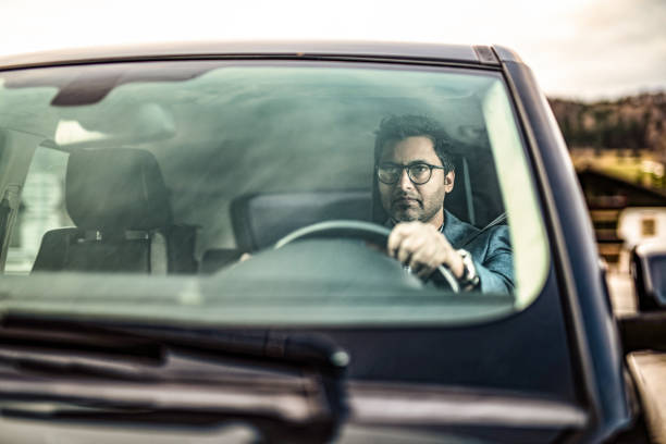 istock Middle Eastern Businessman Driving A Car. 1211981202