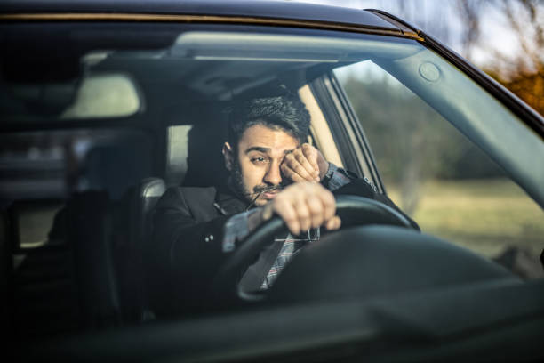 Man Making Effort to See The Road.