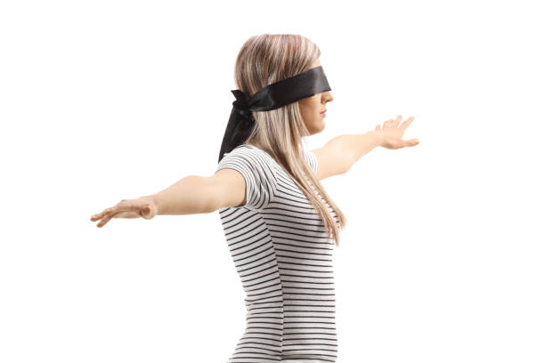 Young woman blindfolded and stills confident isolated on white background